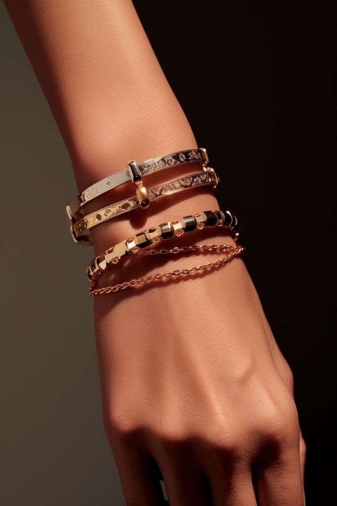 Jewelry on wrists bracelet bangles studio shot.