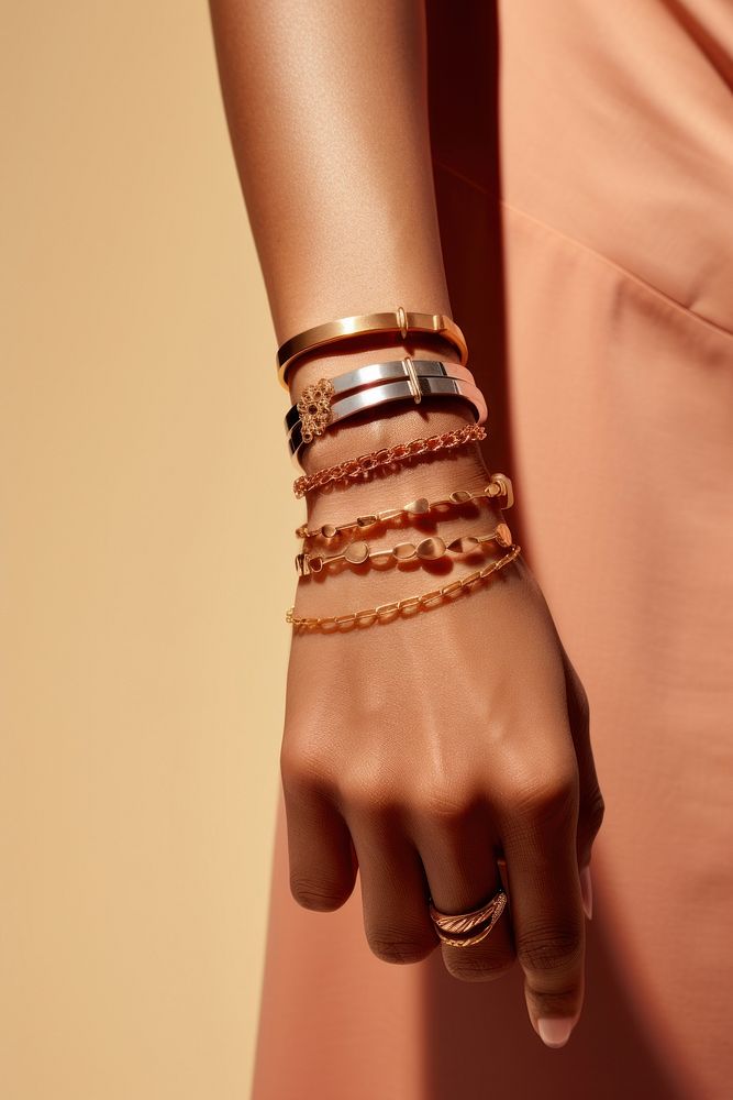 Jewelry on wrists bracelet bangles finger.