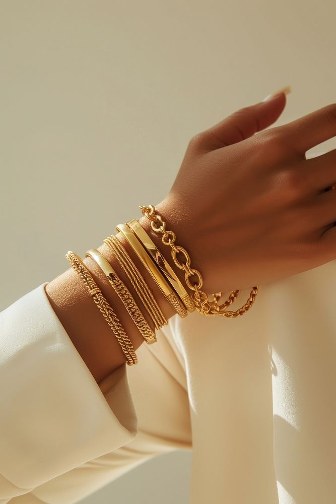 Jewelry on wrists bracelet bangles studio shot.