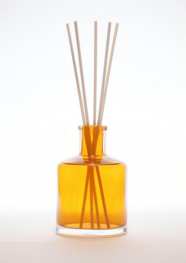 Budget amber glass retro reed diffuser bottle vase white background.