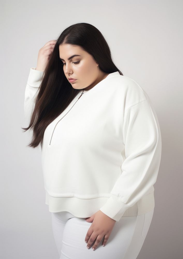 Plus size woman wearing blank white crop knit sweater with zip sweatshirt sleeve blouse.