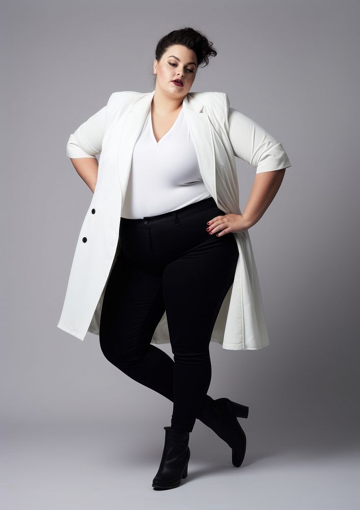 Plus size woman wearing blank white blazer with rolled-up sleeves and black long boot footwear adult coat.