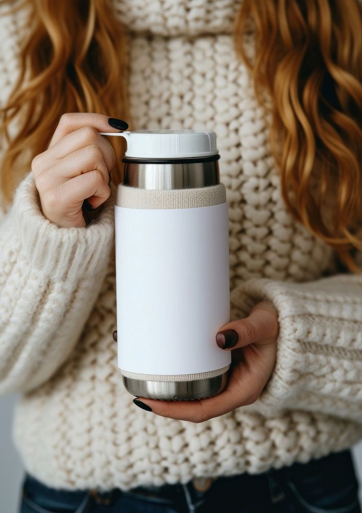 Woman holding a bottle of thermos white photo refreshment.