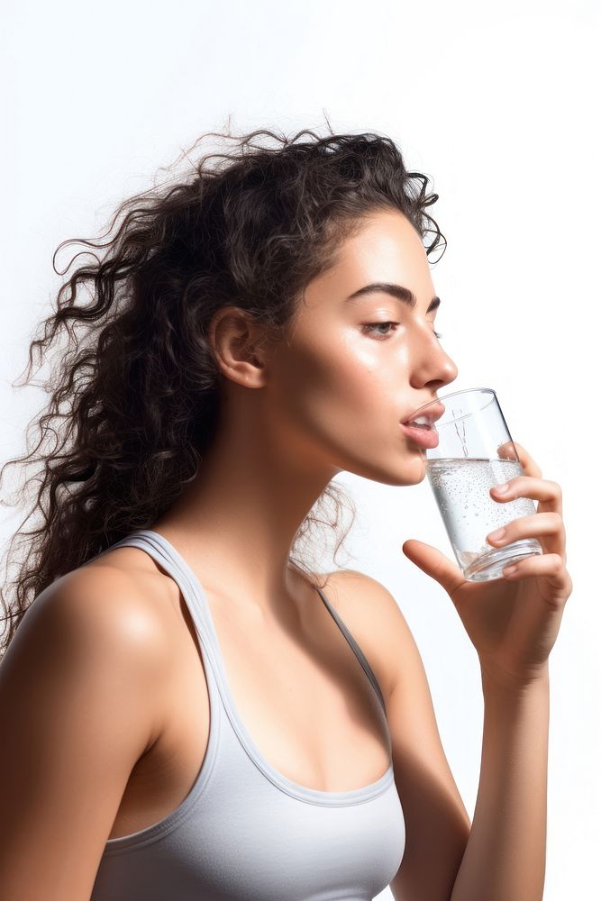 Young woman drinking water after exercising adult photo white background.