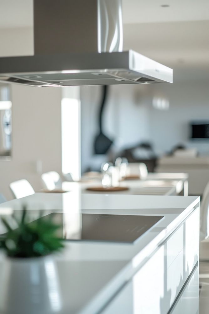 Modern white kitchen with steel kitchen hood architecture countertop appliance.