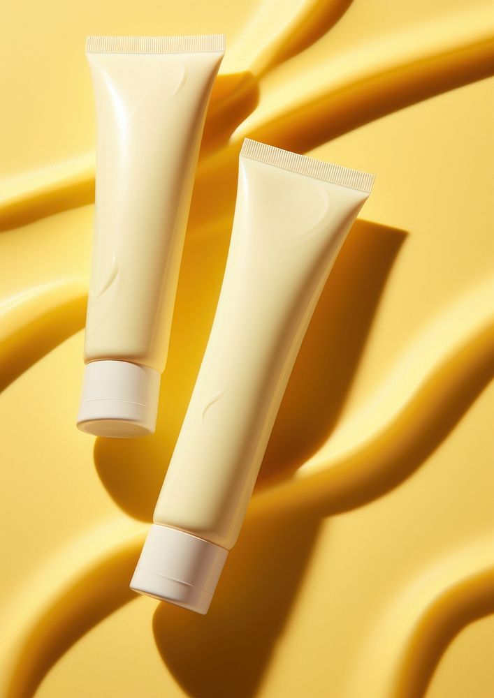 Facial cream tubes yellow yellow background toothpaste.