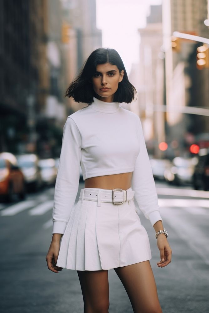 Woman wearing white skorts with belt miniskirt street nature.