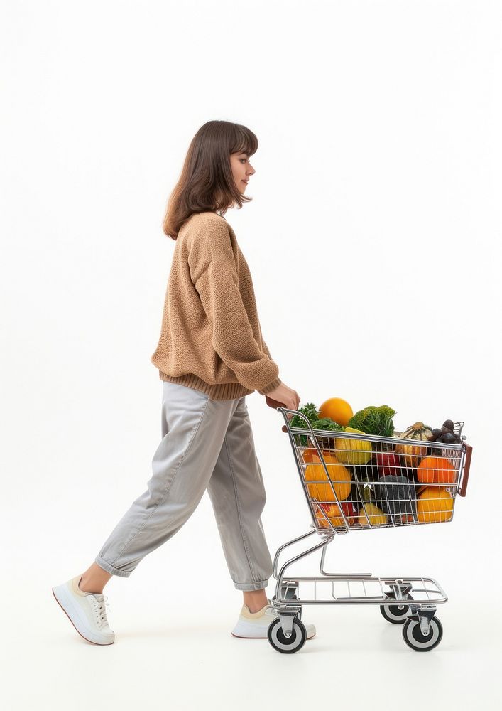 Woman walking with a shopping cart adult white background transportation.