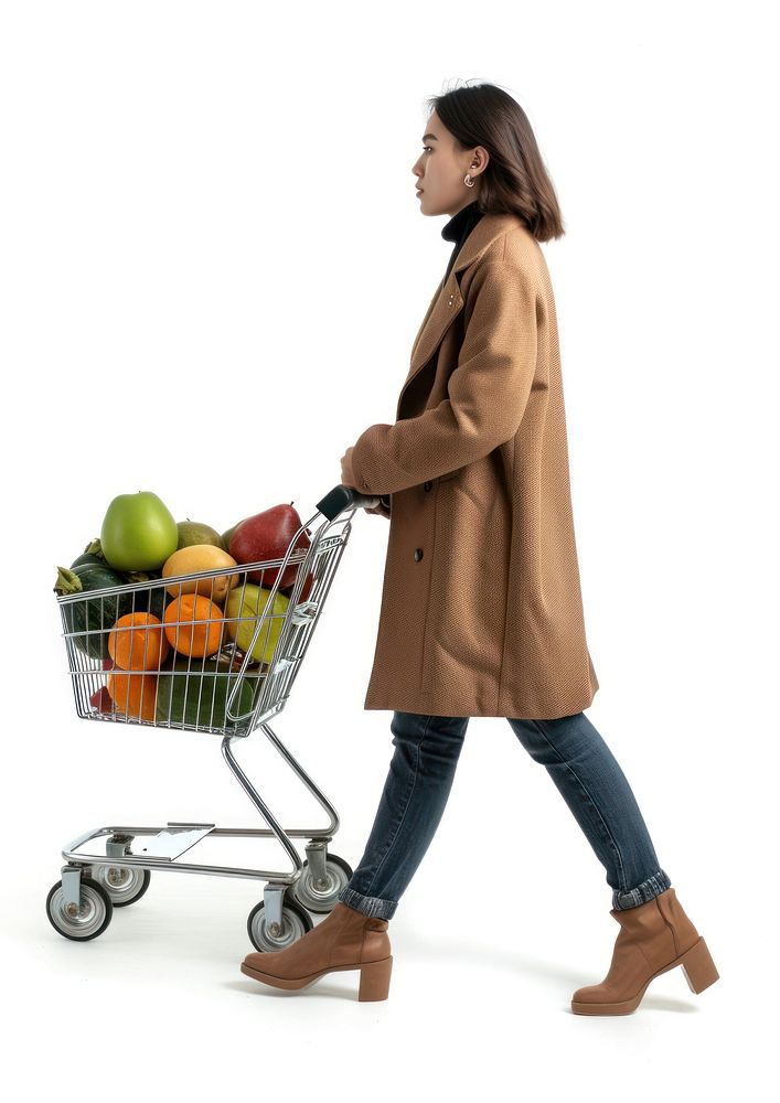 Woman walking with a shopping cart overcoat footwear white background.