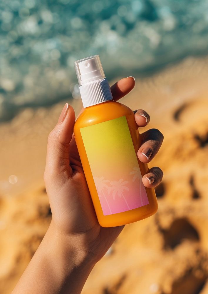 Woman holding sunscreen spray bottle