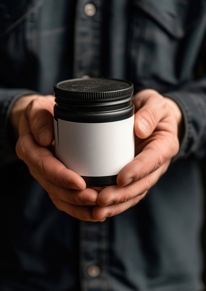 Man holding a canister with machine oil photo cup mug.