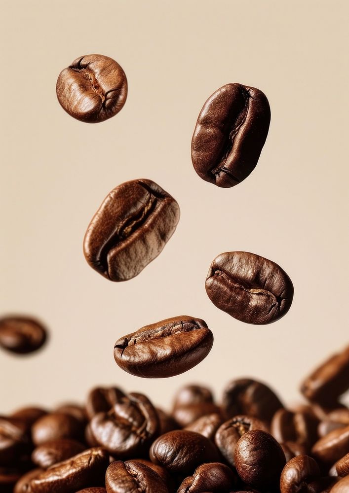 A coffee beans falling invertebrate refreshment freshness.