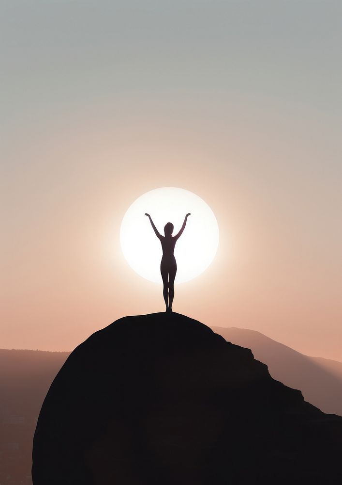 A woman silhouette doing yoga on the mountain in front of the moon adult sky backlighting.