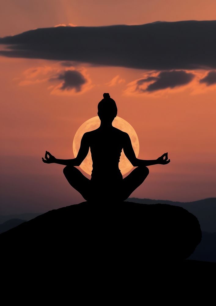 A woman silhouette sitting put the hand together or doing yoga on the mountain in front of the moon backlighting sports…