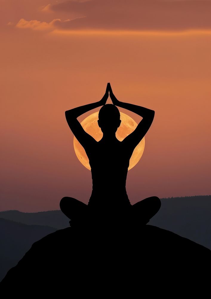 A woman silhouette sitting put the hand together or doing yoga on the mountain in front of the moon sky spirituality…