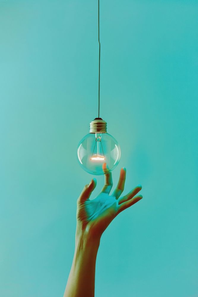 Person holding light bulb lightbulb adult electricity.