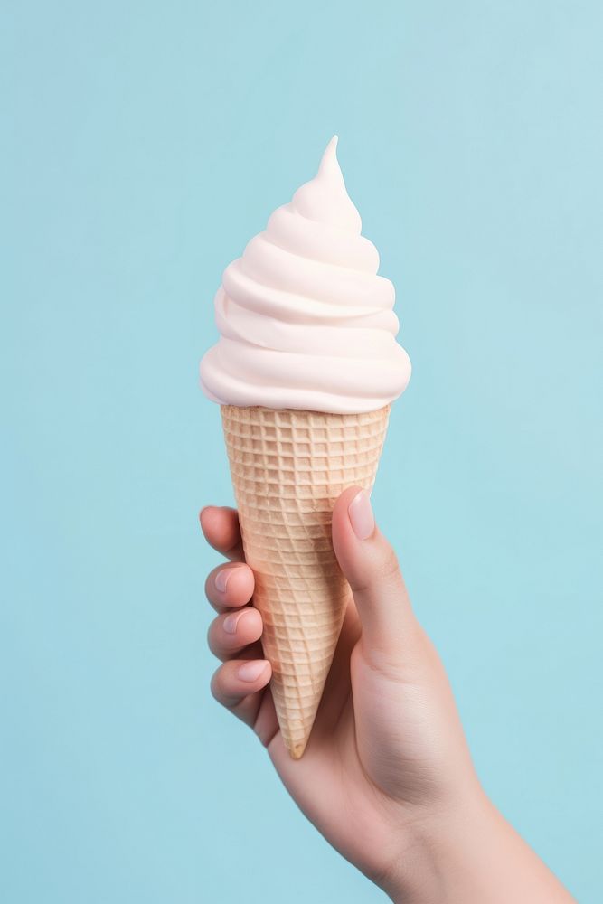 Ice cream cone dessert holding food.