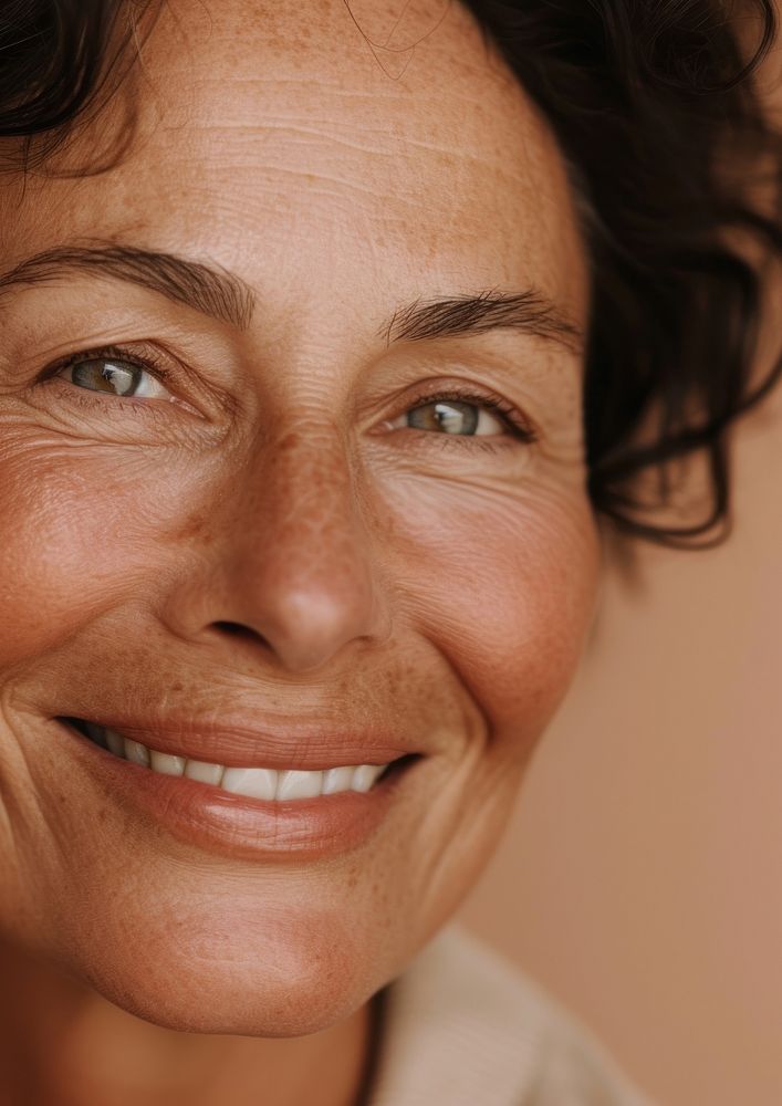 Middle age woman happy with no makeup smile skin portrait.