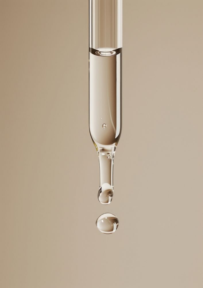 Clear oil serum flowing out of the skincare dropper glass transparent refreshment.