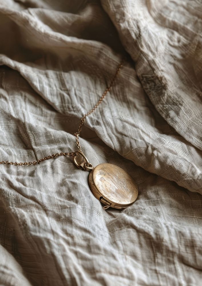 A minimal gold locket necklace pendant jewelry accessories.
