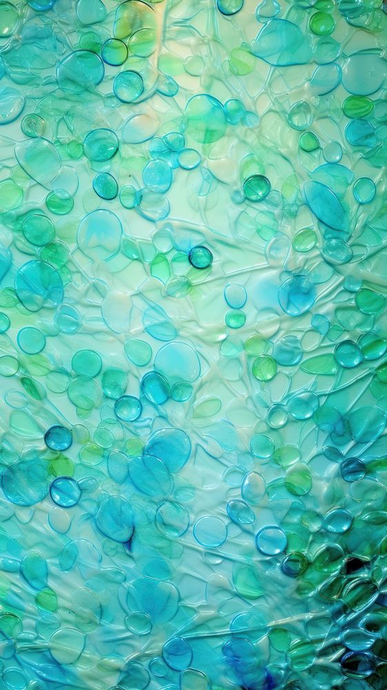 Undersea glass fusing art turquoise textured outdoors.