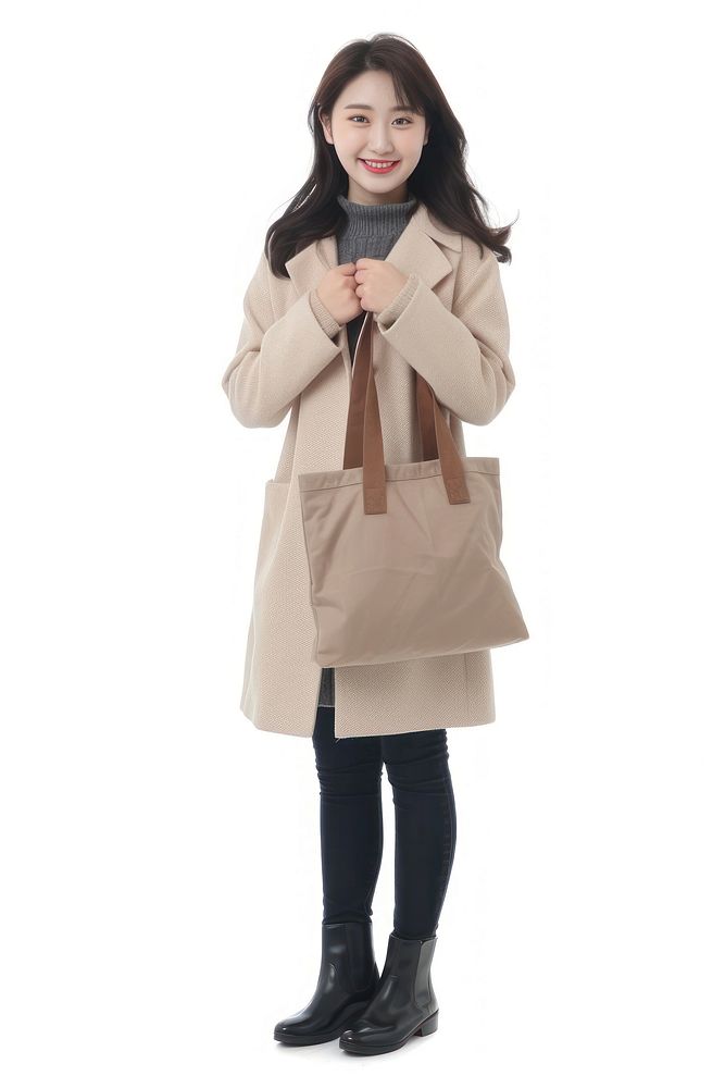 Happy chinese woman bag overcoat standing.