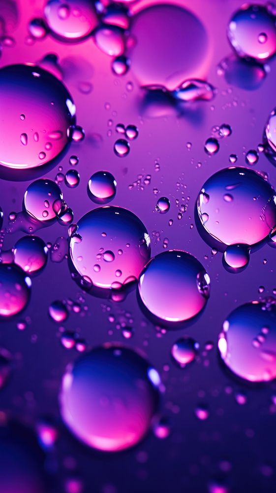 Water drops in neon lighting purple backgrounds abstract.