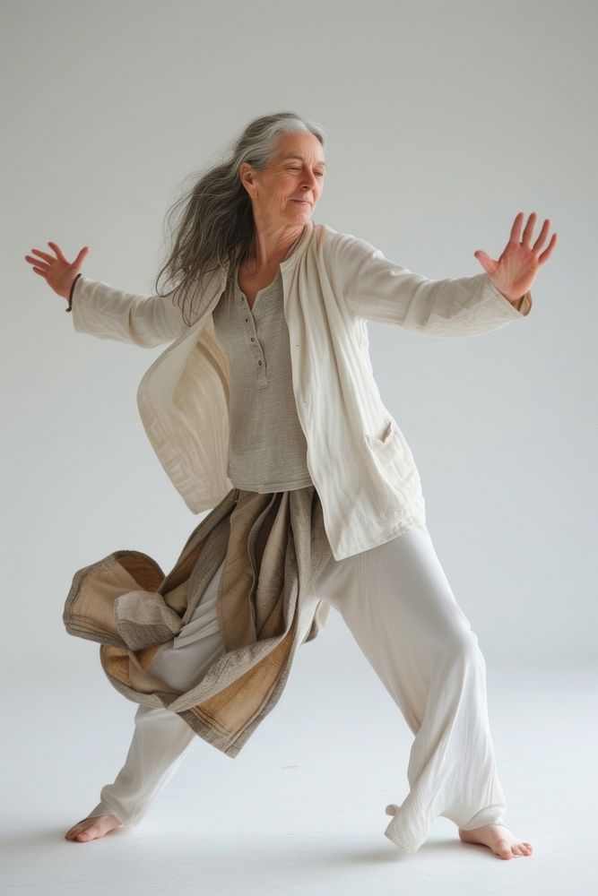 Mature woman dancing on white sports adult flexibility.