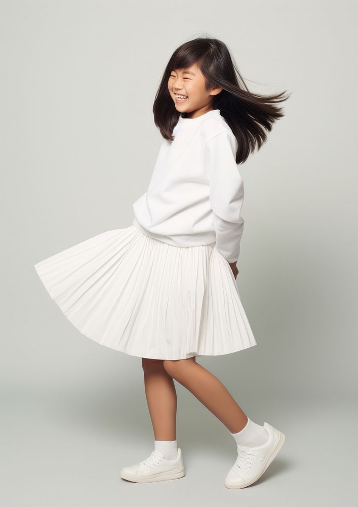 Cheerful asian kid skirt miniskirt white.