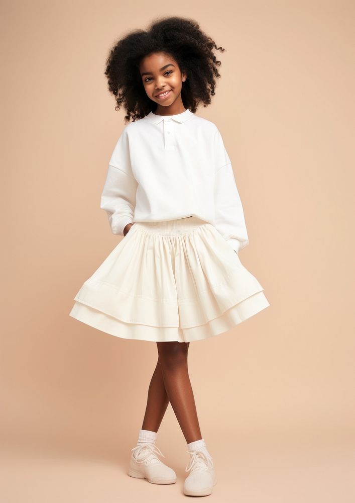 Cheerful black kid wearing blank white polo sweatshirt and white contrast pleated skirt miniskirt sleeve child.