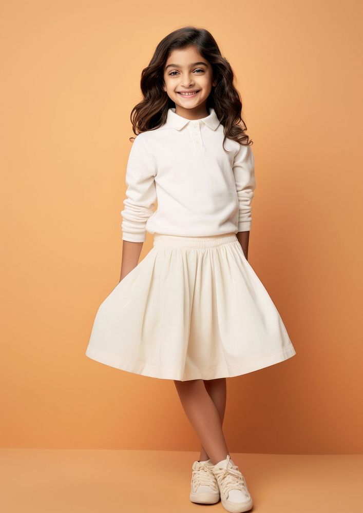 Cheerful indian kid wearing blank white polo sweatshirt and white contrast pleated skirt miniskirt footwear child.