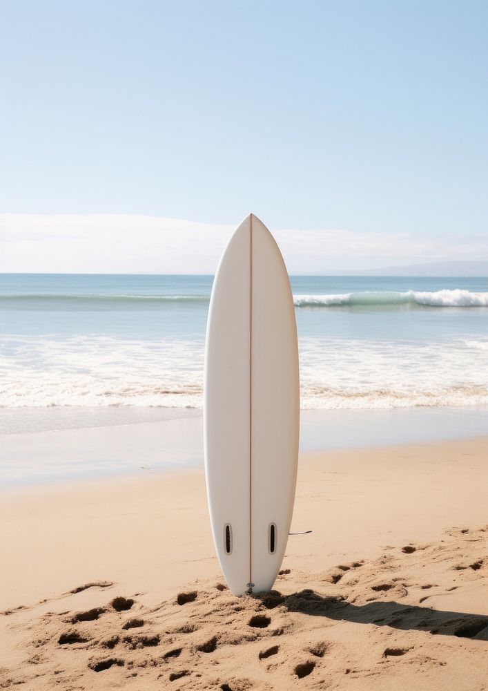 White surfboard on the beach outdoors surfing nature.