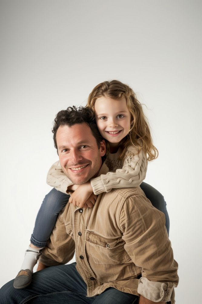 Happy father with young girl on back portrait adult smile.