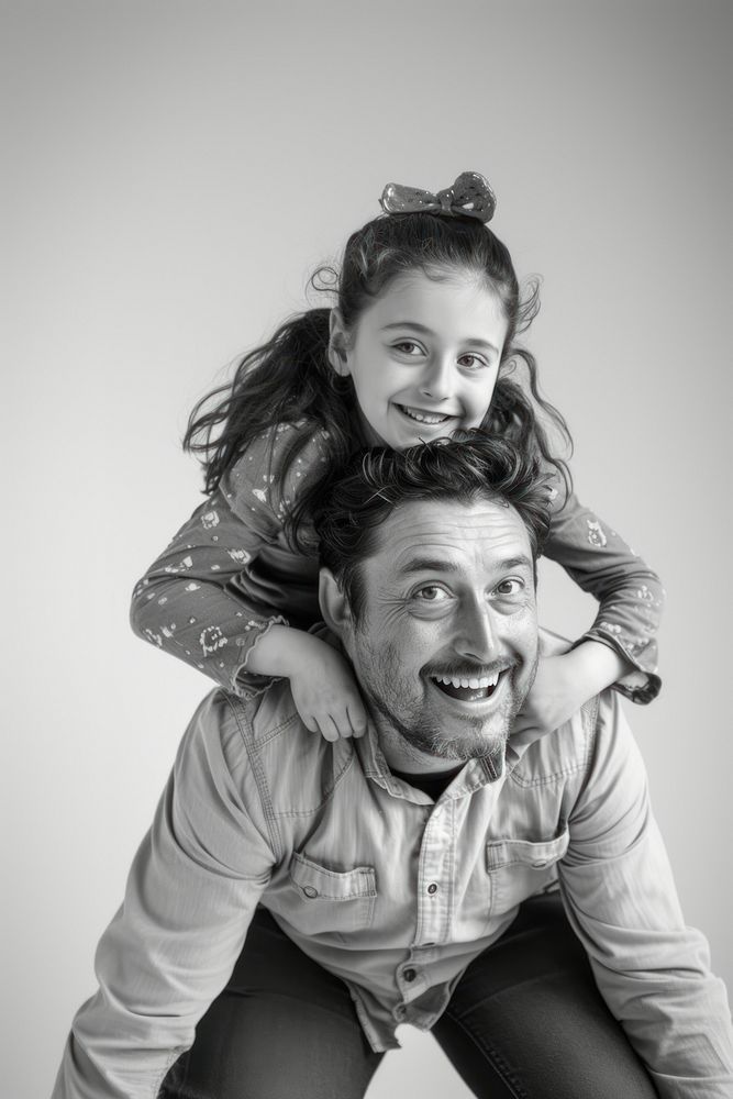 Happy father with young girl on back portrait adult smile.