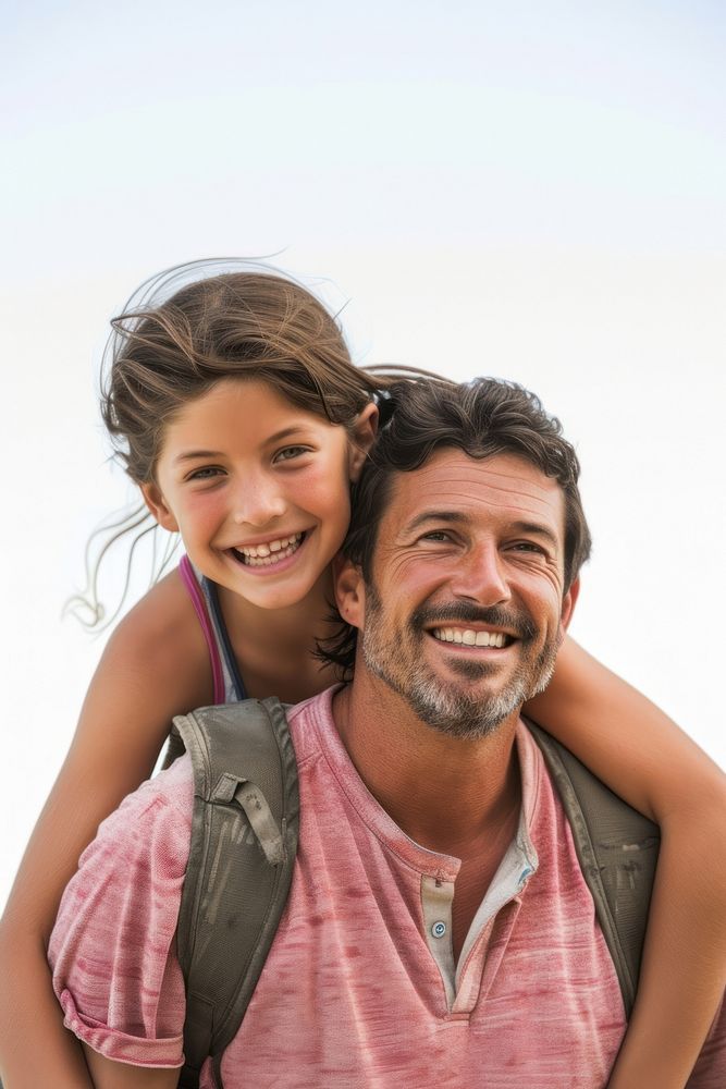 Happy father with young girl on back laughing portrait adult.