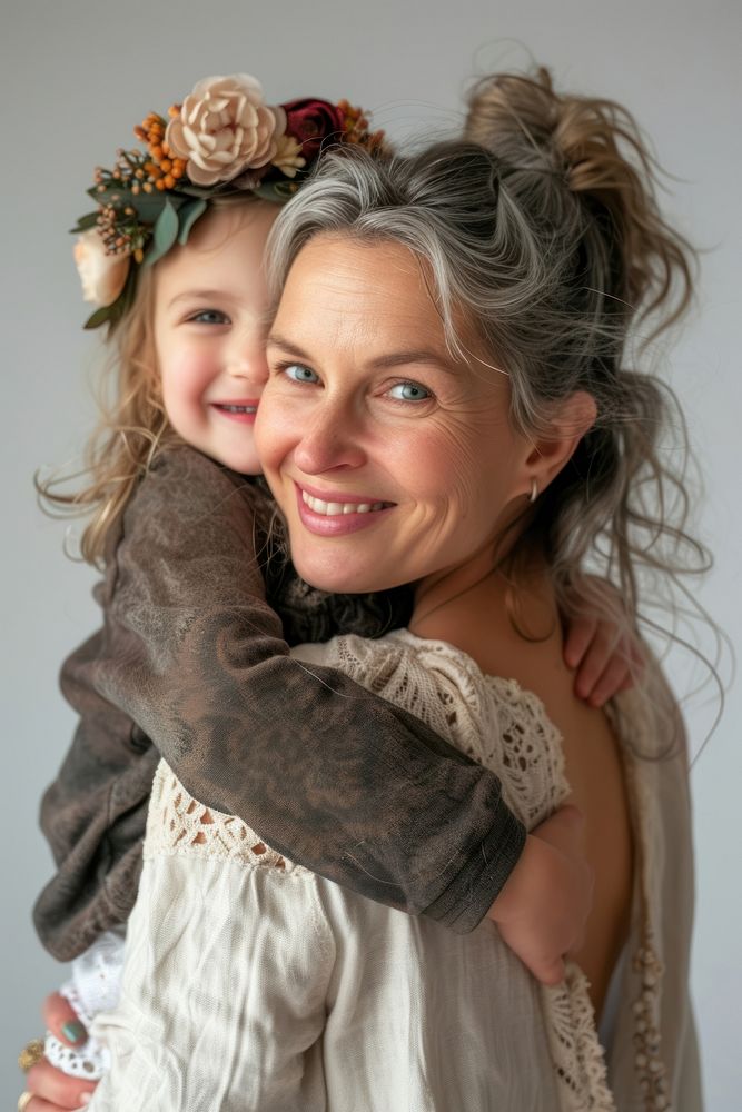 Happy mom with young girl on back portrait fashion hugging.