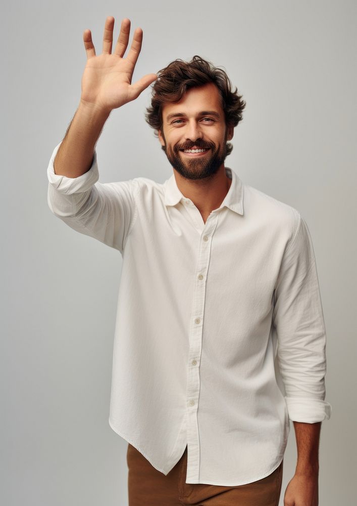 Person waving portrait person shirt.