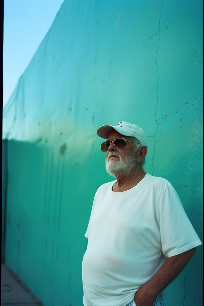 Old man wearing white streetwear clothes architecture portrait glasses.