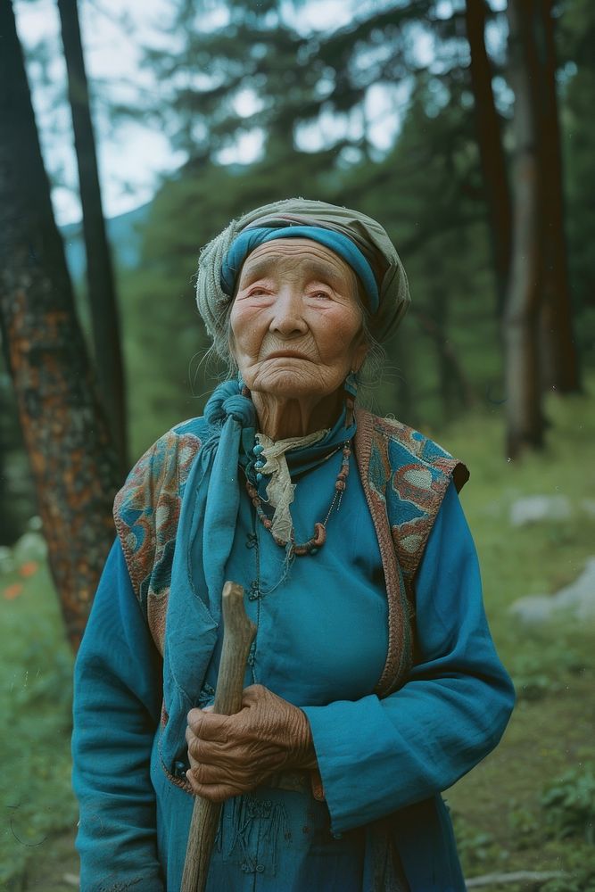 Old woman wearing blue clothes adult retirement landscape.