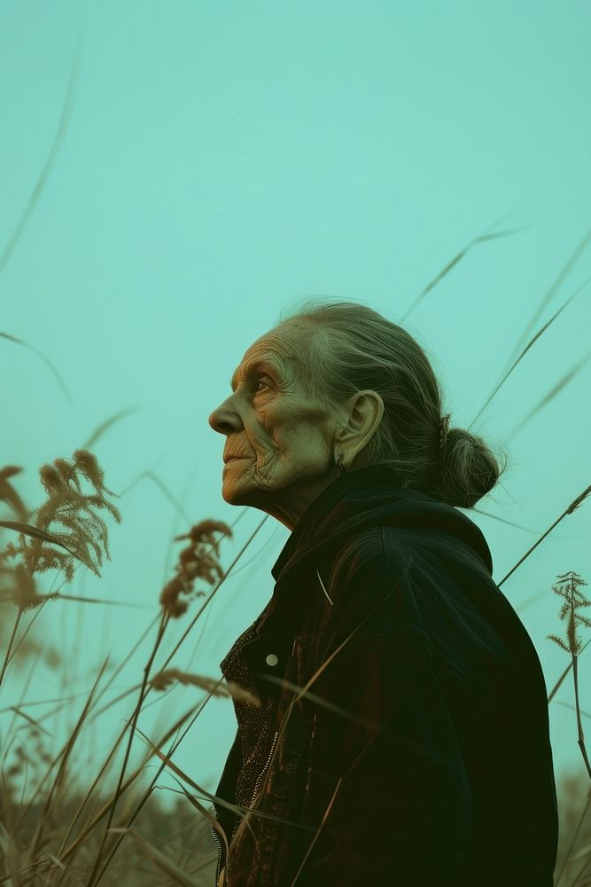 A old woman wearing black streetwear clothes portrait adult plant.