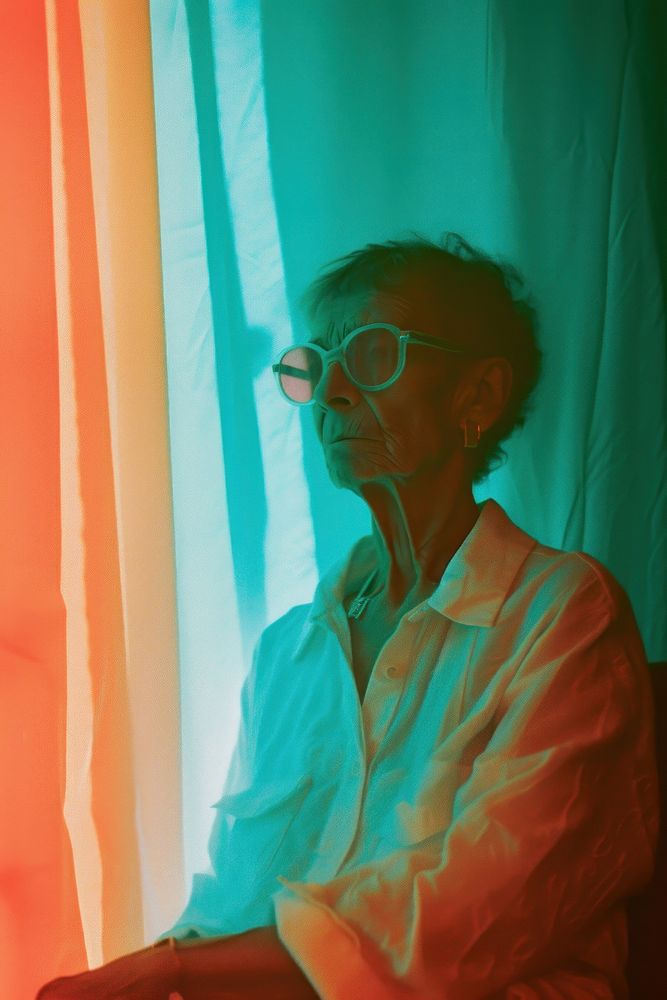 Old woman wearing white streetwear clothes portrait glasses curtain.