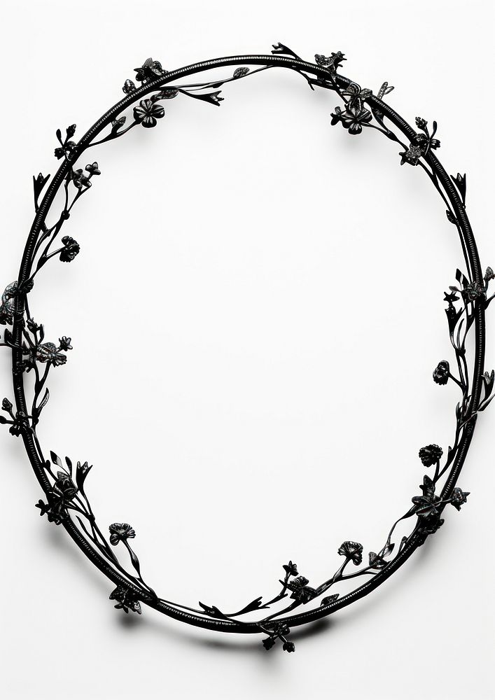 Ornamental black oval jewelry wire white background.