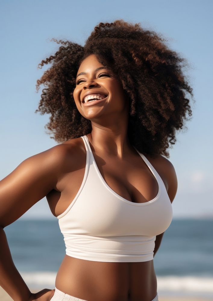 Chubby black woman swimwear outdoors smiling.