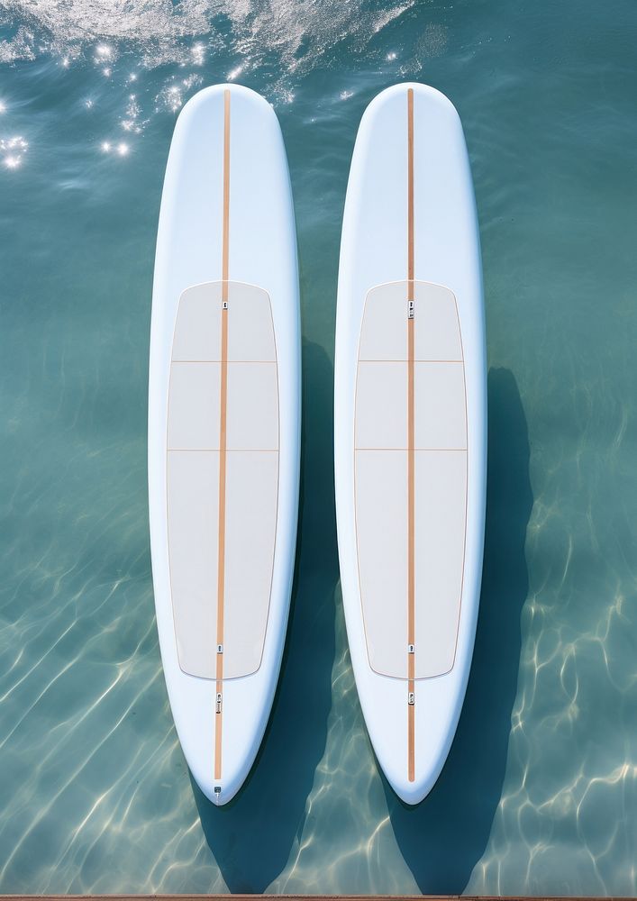 Two white blank surfboards recreation outdoors vehicle.