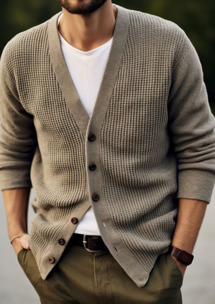 Man wear loose fitting V-neck cardigan sweater sleeve day.
