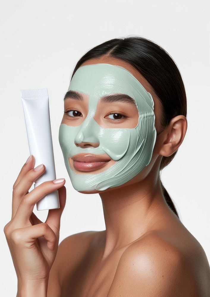 Young woman with organic mask portrait holding adult.