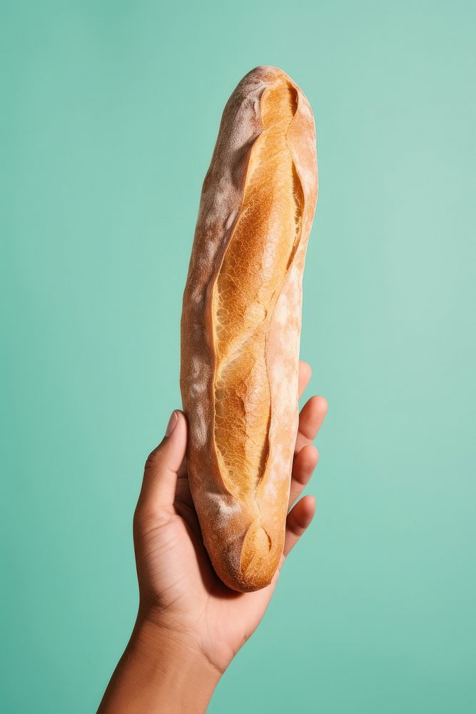 Baguette holding bread food.