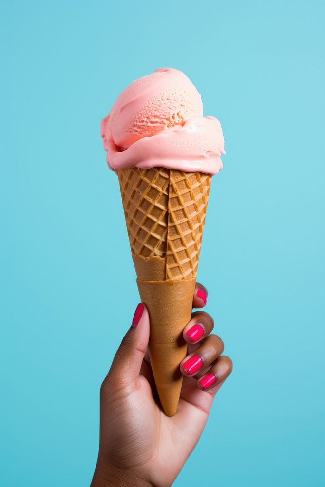 Hand holding ice cream cone dessert food medication.