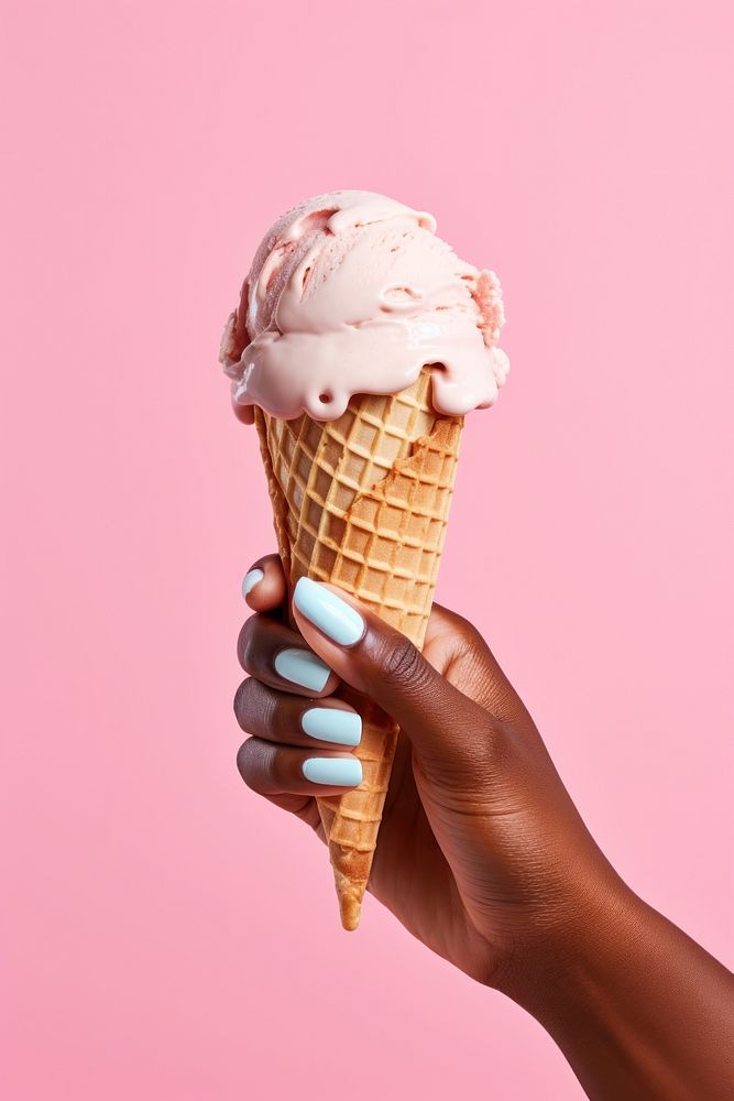 Hand holding ice cream cone dessert food chocolate.