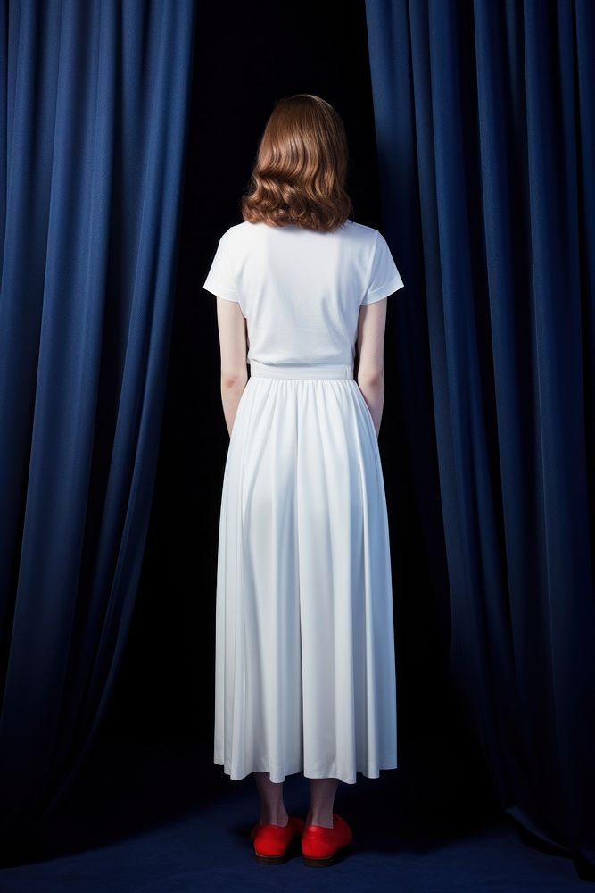 A half-america woman in a clean white dress footwear standing curtain.